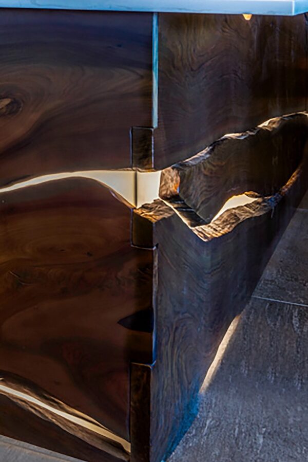 Walnut live-edge bar with bow-tie joinery detail