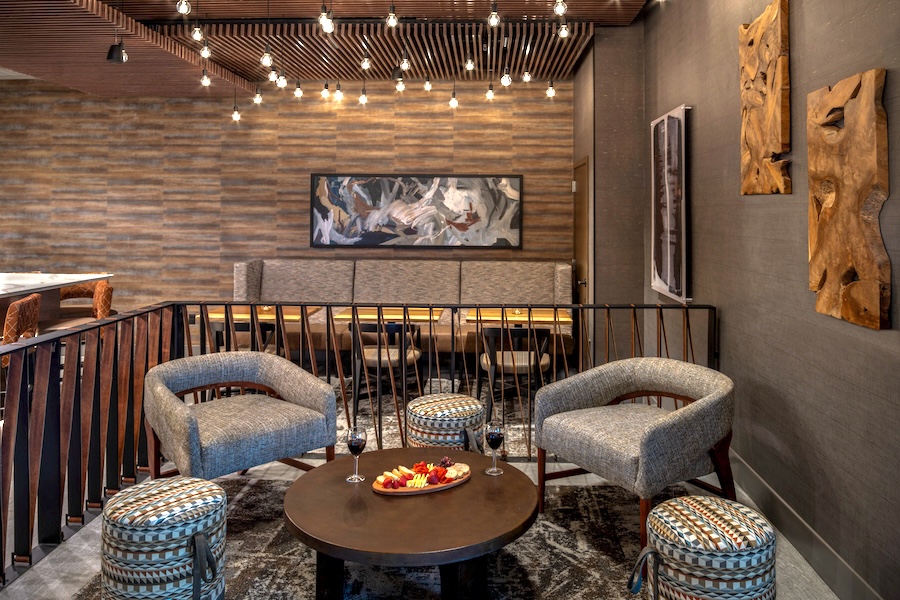 Lounge seating group with banquette and warm pendant lights