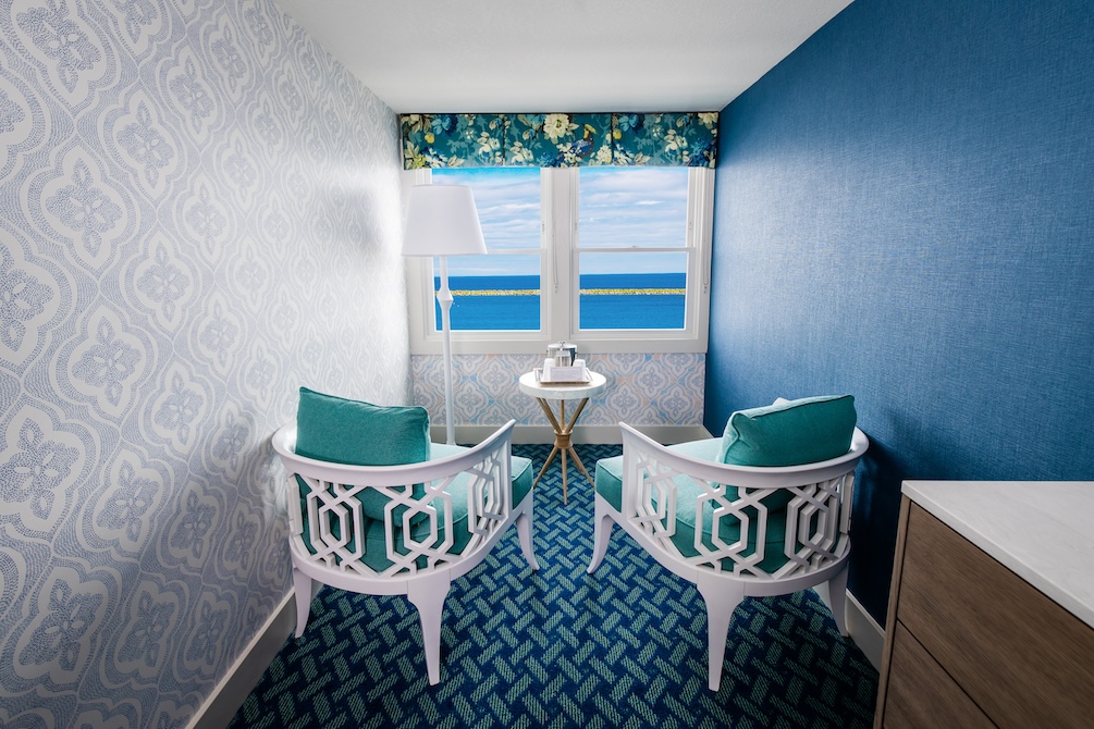 Bay window seating at Lake View Hotel with chairs facing a lakefront view.