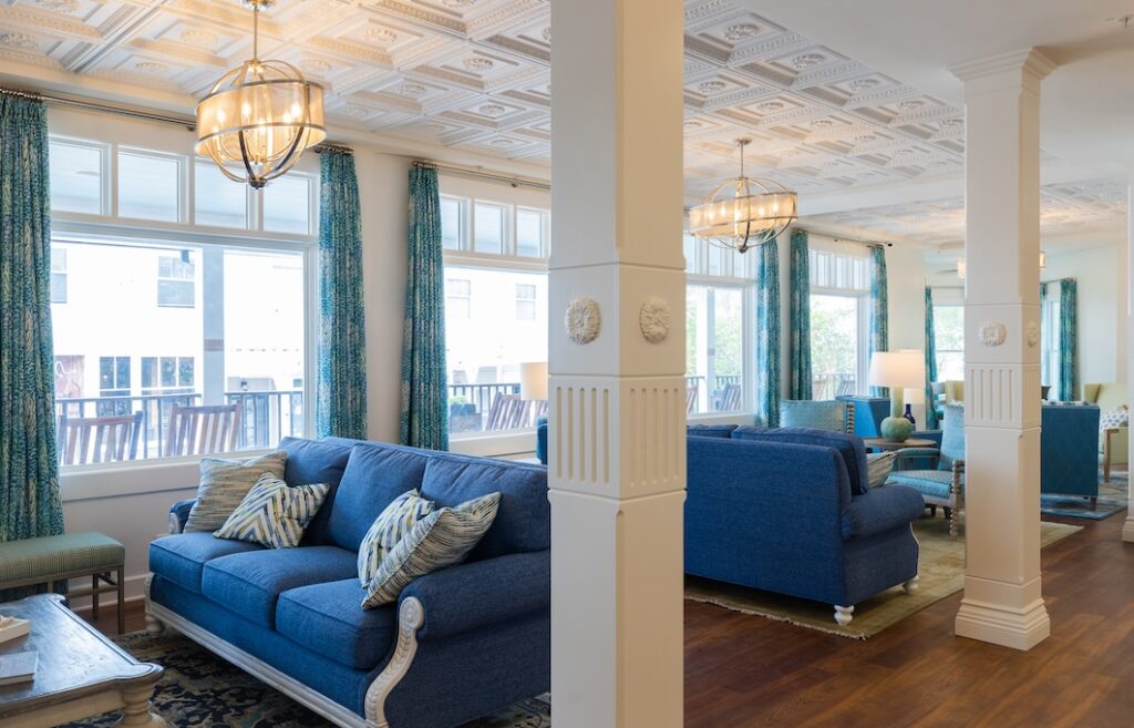 Angle view of Lake View Hotel lobby with blue sofas and tall windows.